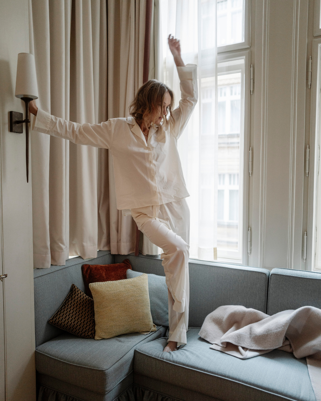 Cut details of pajamas from the One Way Or Another collection in a hotel room